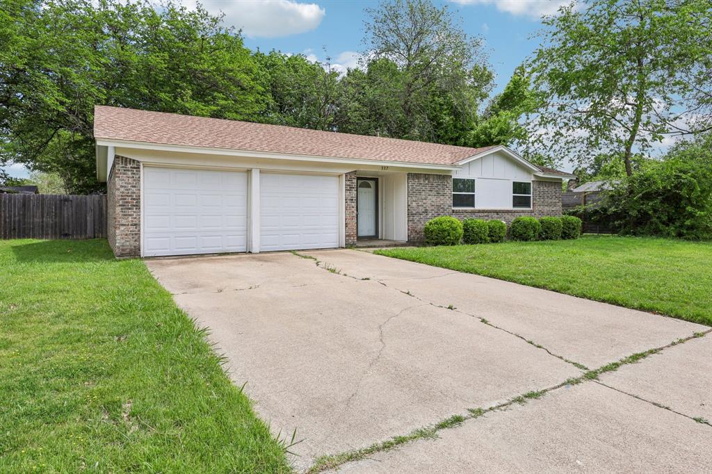 337 Apache Trail Keller, TX 76248 - Photo 3 of 36 a front view of a house with a yard and garage
