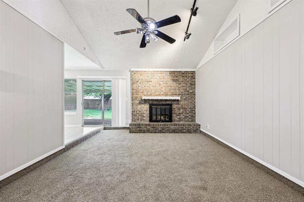 337 Apache Trail Keller, TX 76248 - Photo 6 of 36 a view of an empty room with a fireplace and a window