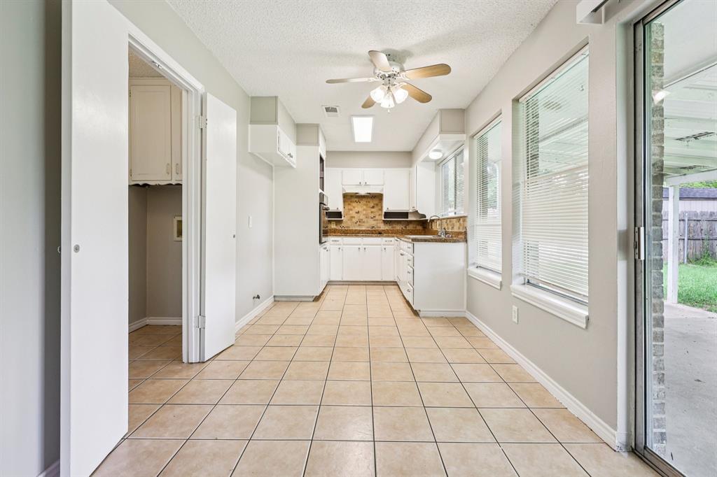 337 Apache Trail Keller, TX 76248 - Photo 8 of 36 a large white kitchen with granite countertop a refrigerator and a stove top oven
