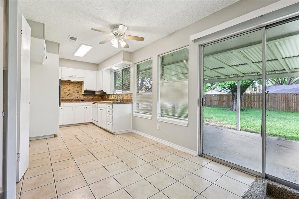 337 Apache Trail Keller, TX 76248 - Photo 9 of 36 a kitchen with a sink a stove and cabinets
