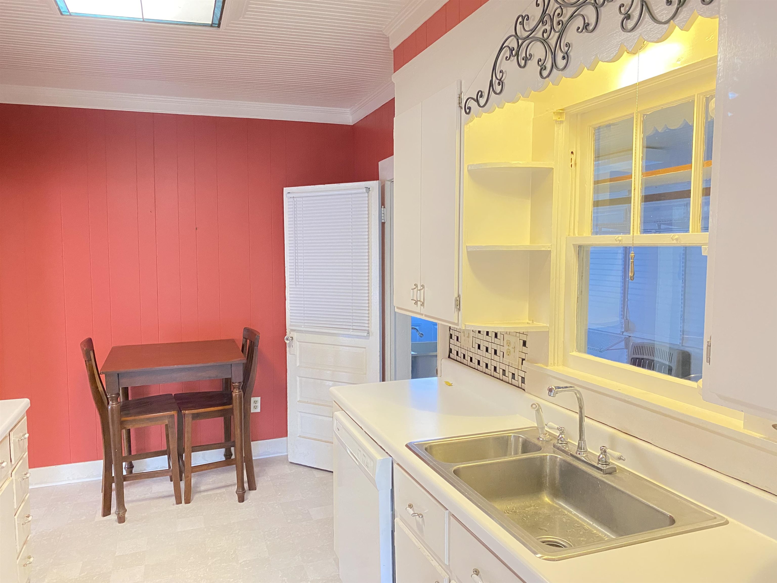 240 South Oak Street Adamsville, TN 38310 - Photo 12 of 29 a kitchen with a sink and a chair