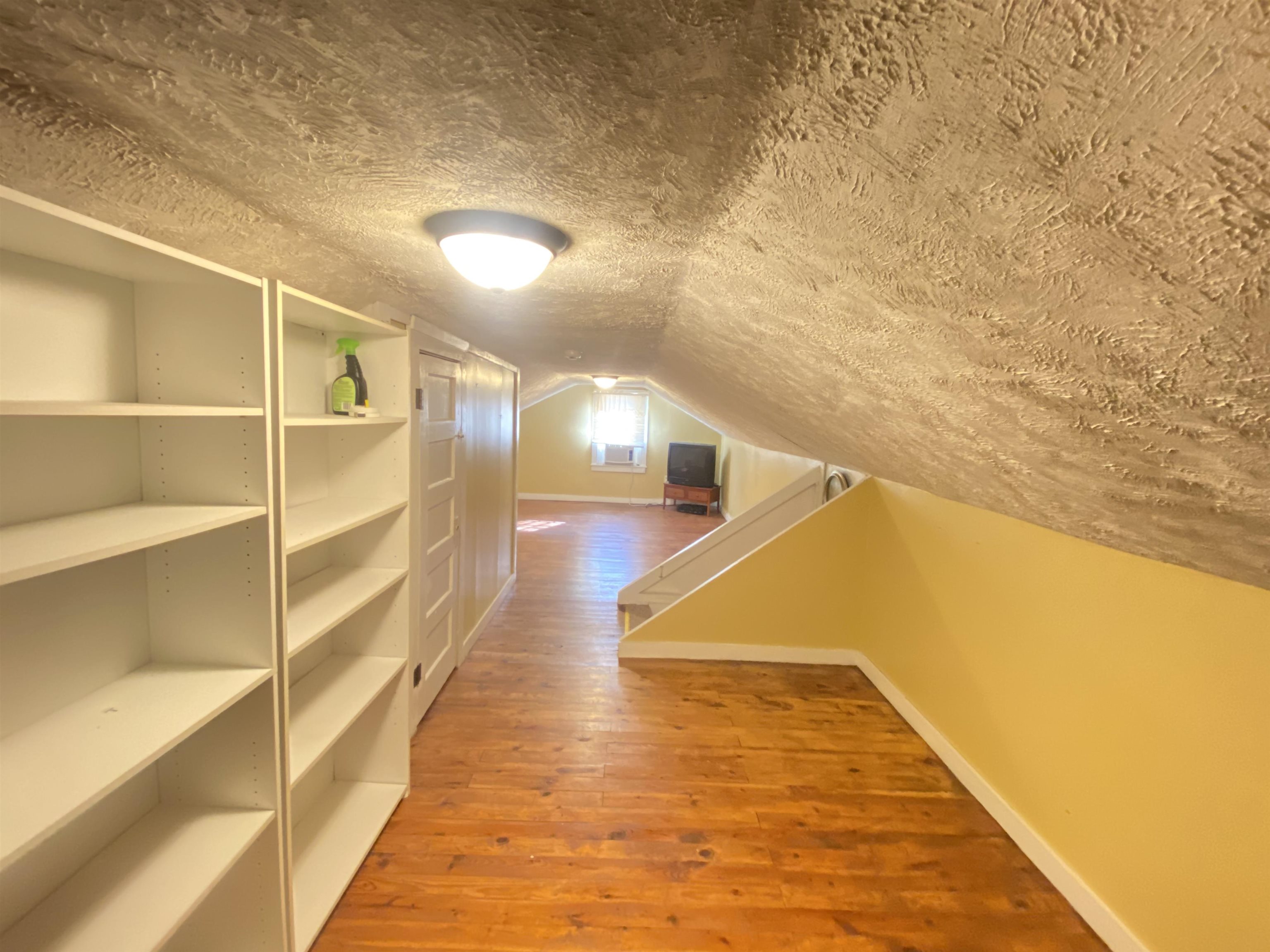 240 South Oak Street Adamsville, TN 38310 - Photo 15 of 29 a view of a room with wooden floor