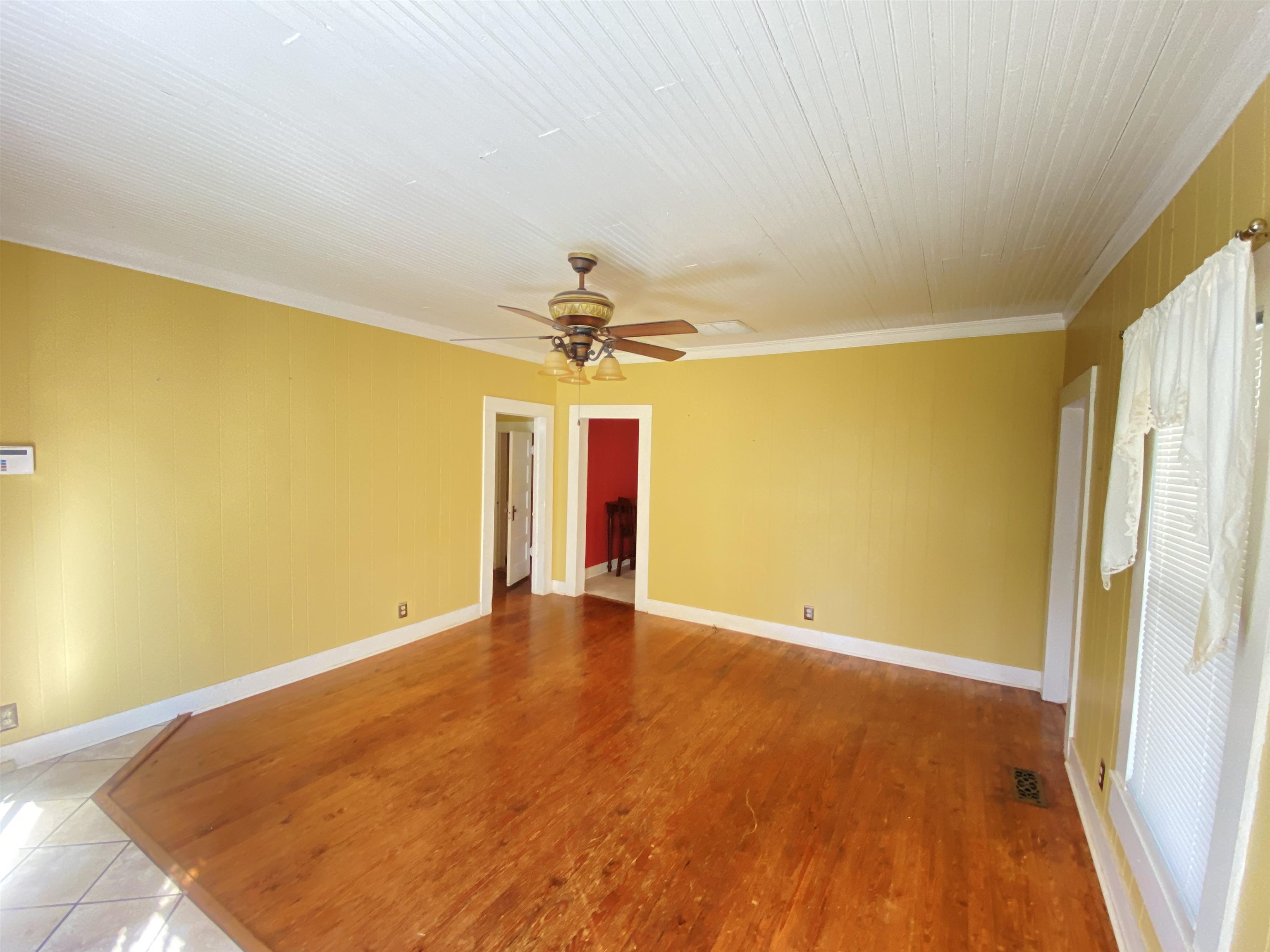 240 South Oak Street Adamsville, TN 38310 - Photo 15 of 29 a view of an empty room with a window