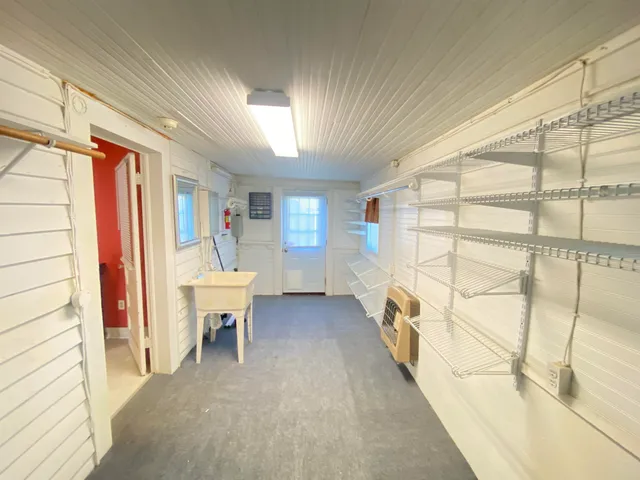 a bed room with a bed and a chair