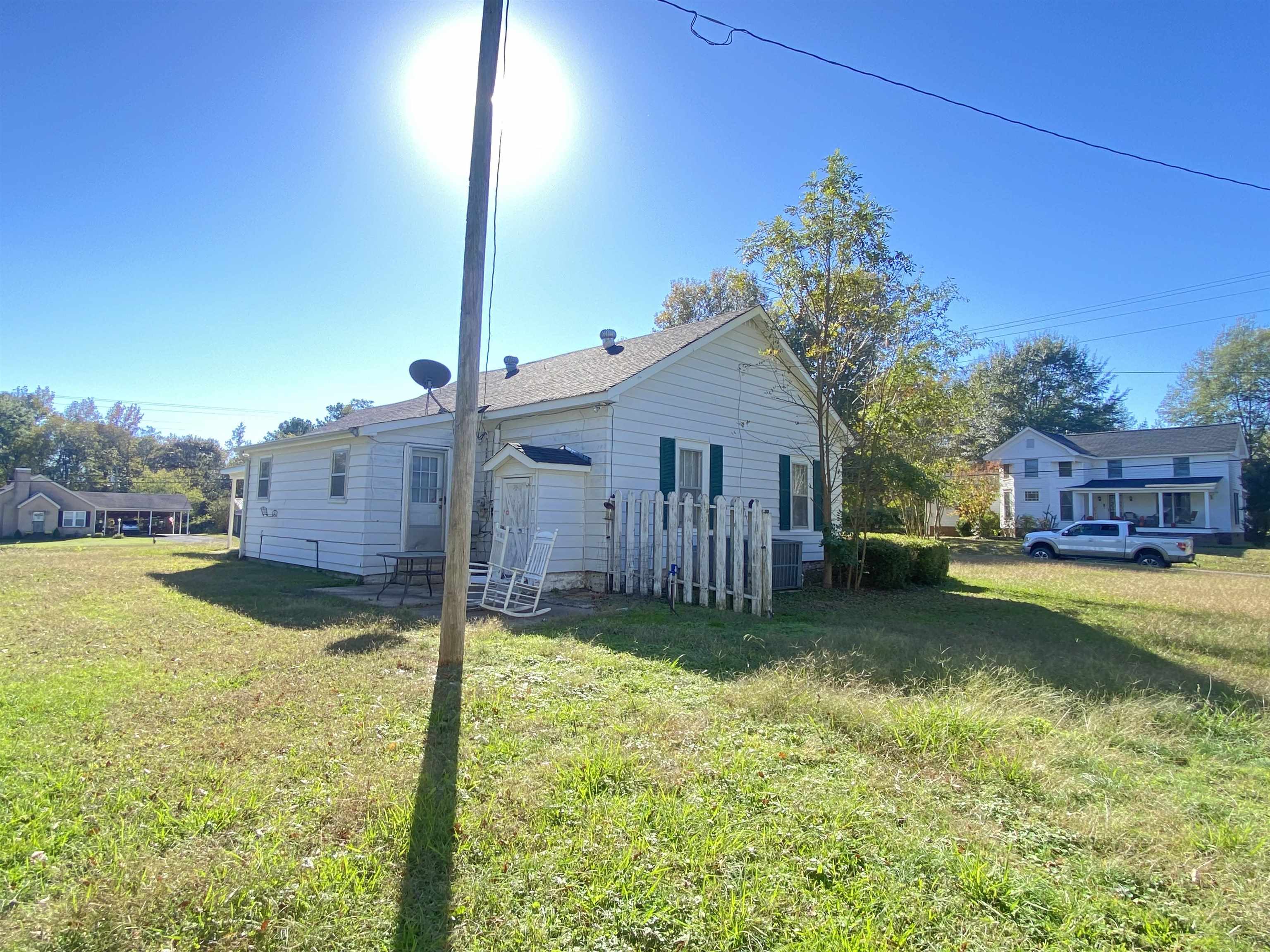 240 South Oak Street Adamsville, TN 38310 - Photo 2 of 29 a view of a house with a yard