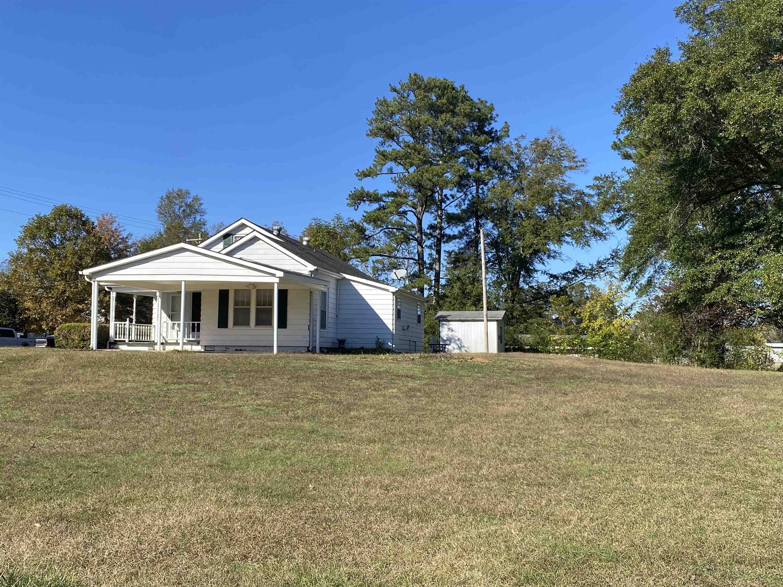 240 South Oak Street Adamsville, TN 38310 - Photo 22 of 29 a front view of a house with yard
