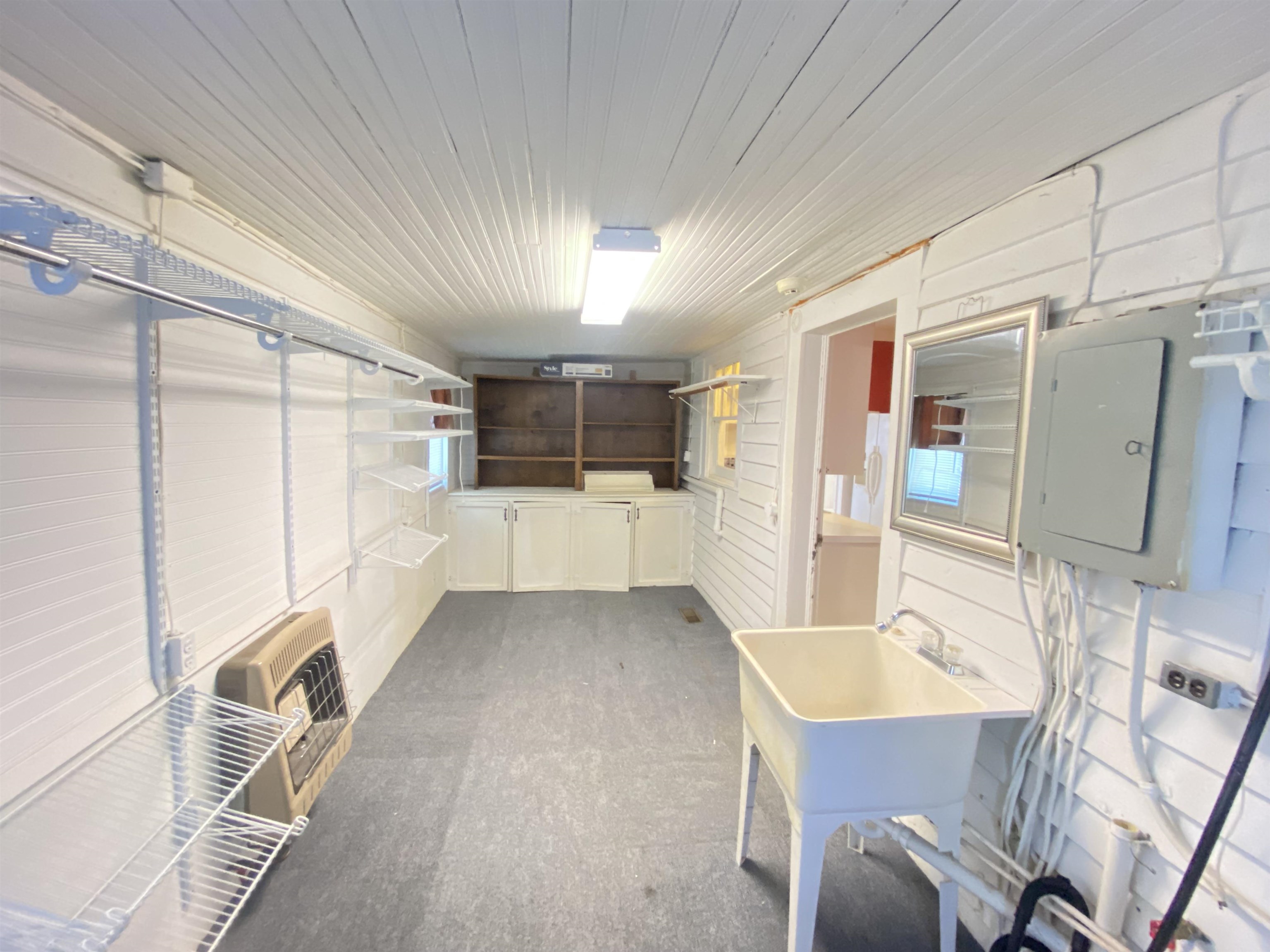 240 South Oak Street Adamsville, TN 38310 - Photo 23 of 29 a kitchen with granite countertop a refrigerator and a sink