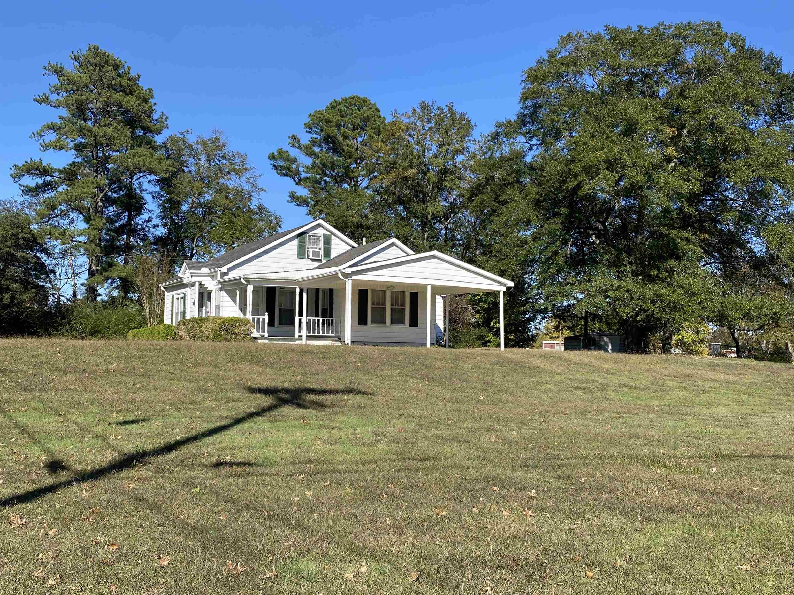 240 South Oak Street Adamsville, TN 38310 - Photo 27 of 29 a front view of a house with a garden