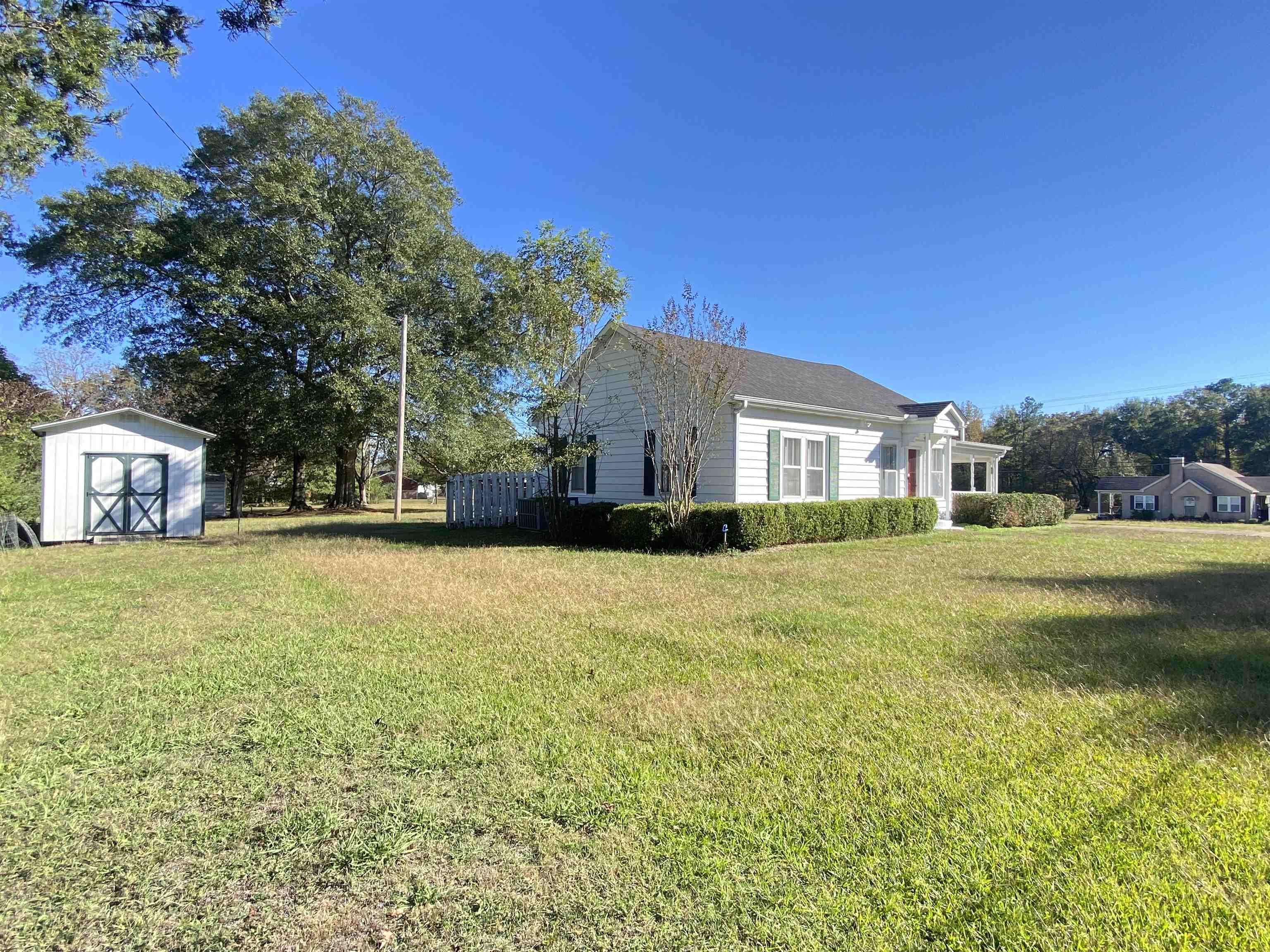 240 South Oak Street Adamsville, TN 38310 - Photo 27 of 29 a front view of a house with a yard