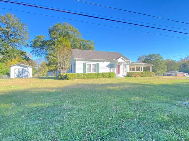 a house view with a garden space