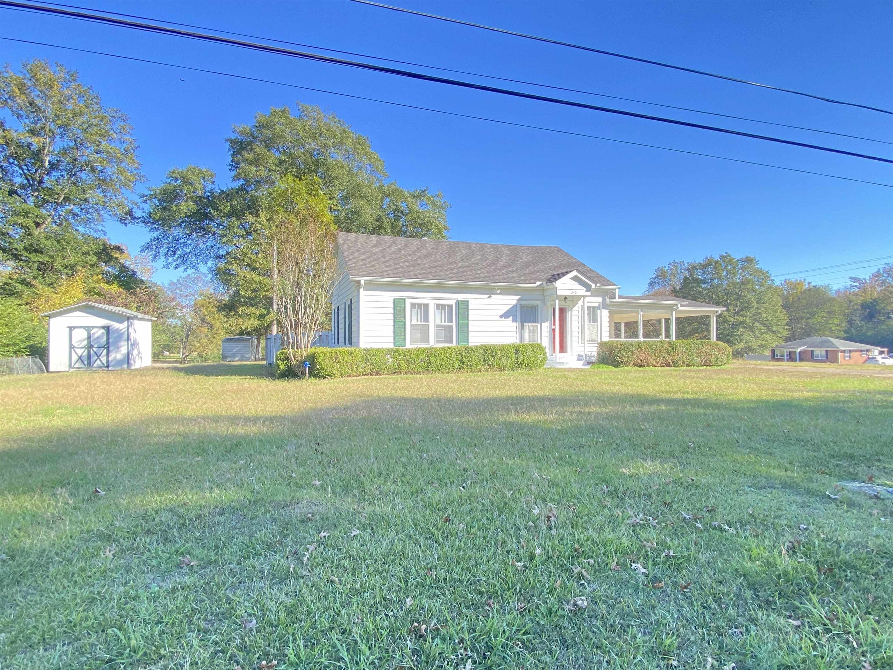240 South Oak Street Adamsville, TN 38310 - Photo 28 of 29 a house view with a garden space