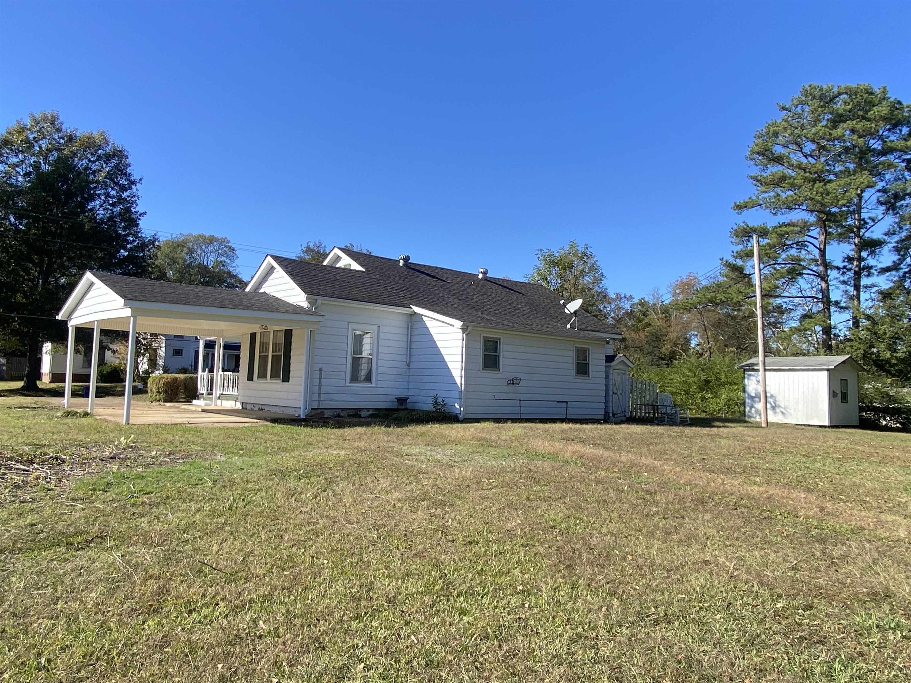 240 South Oak Street Adamsville, TN 38310 - Photo 29 of 29 a front view of a house with a yard