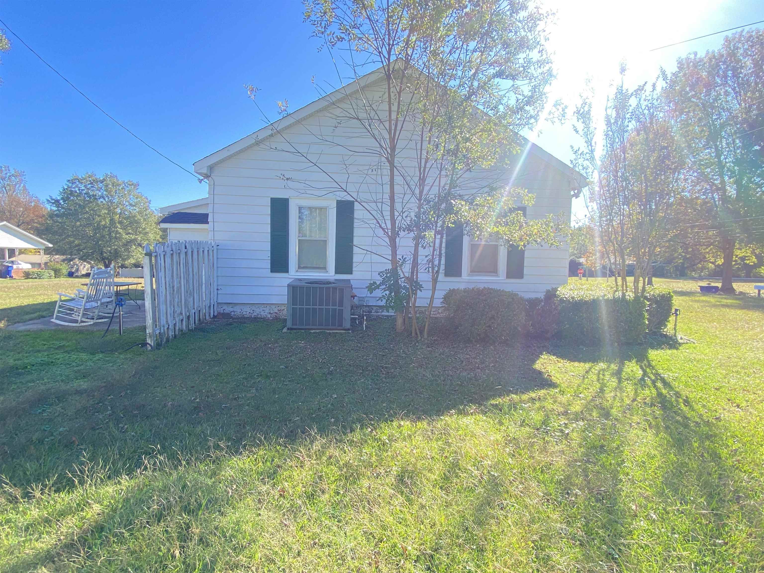 240 South Oak Street Adamsville, TN 38310 - Photo 3 of 29 a view of a house with backyard and garden