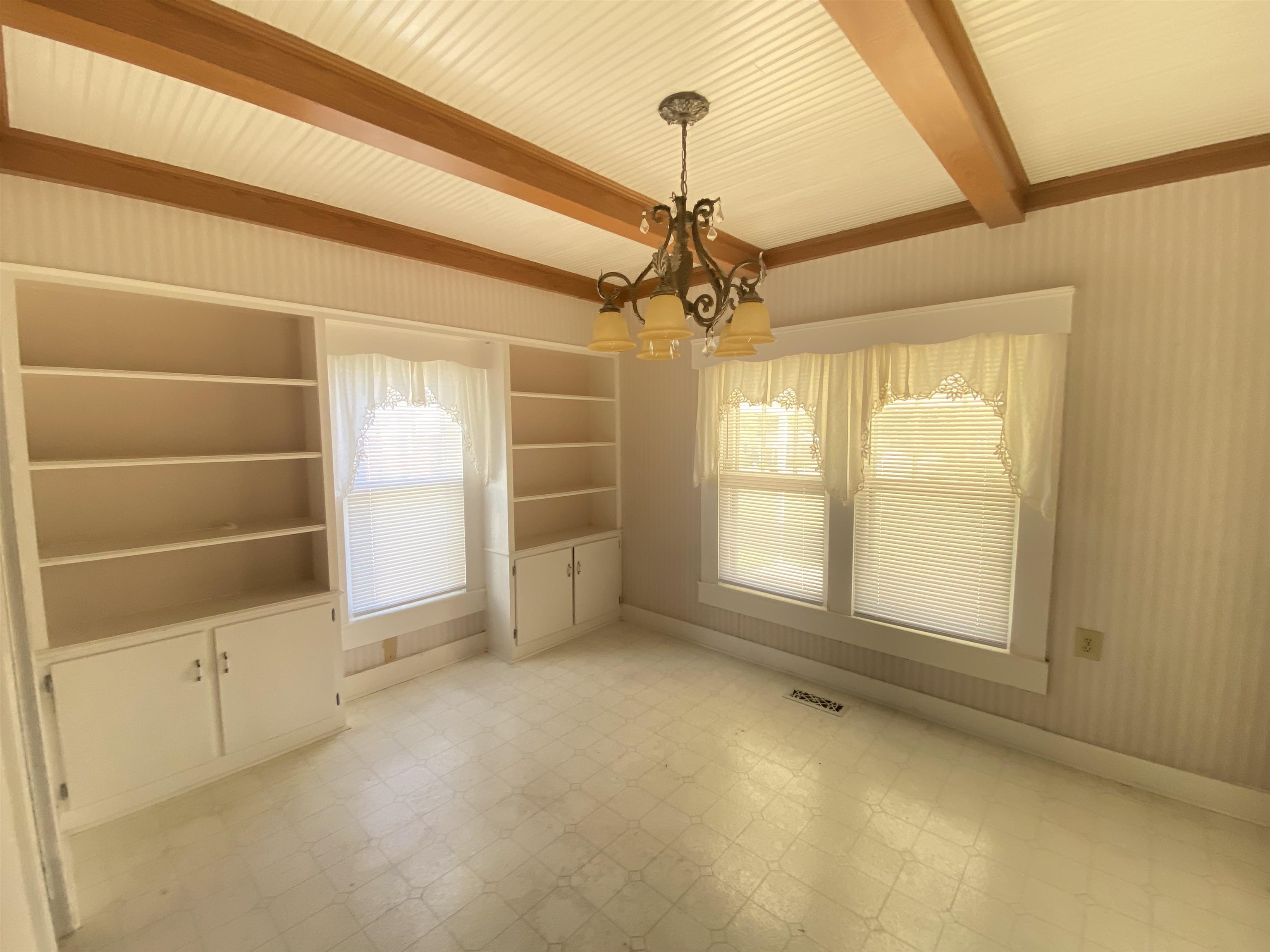 240 South Oak Street Adamsville, TN 38310 - Photo 8 of 29 a view of an empty room with a window