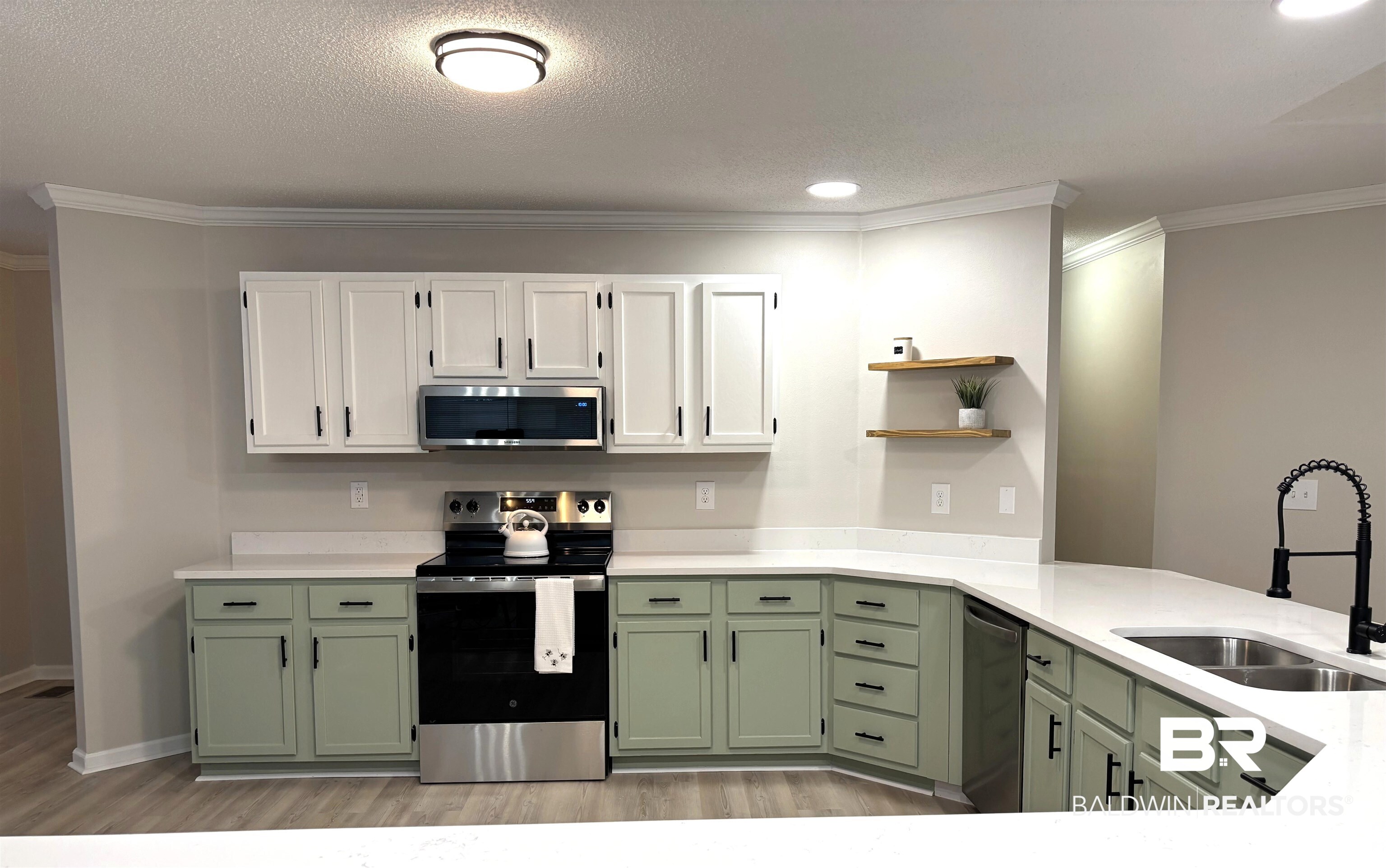 35650 Spring Road North Stapleton, AL 36578 - Photo 14 of 70 Kitchen featuring green cabinets, stainless steel appliances, white cabinetry, ornamental molding, and light stone countertops