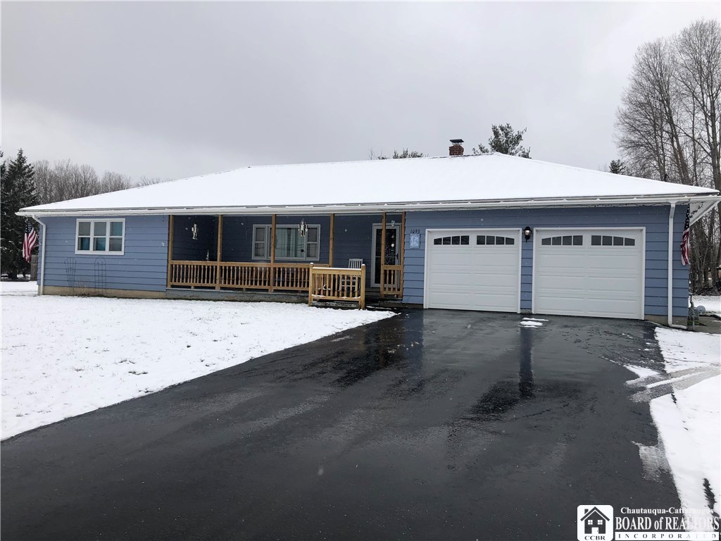 1093 South Main St Extension Busti, NY 14701 - Photo 1 of 1 Front View. In 2018--New Railing. New Garage Door