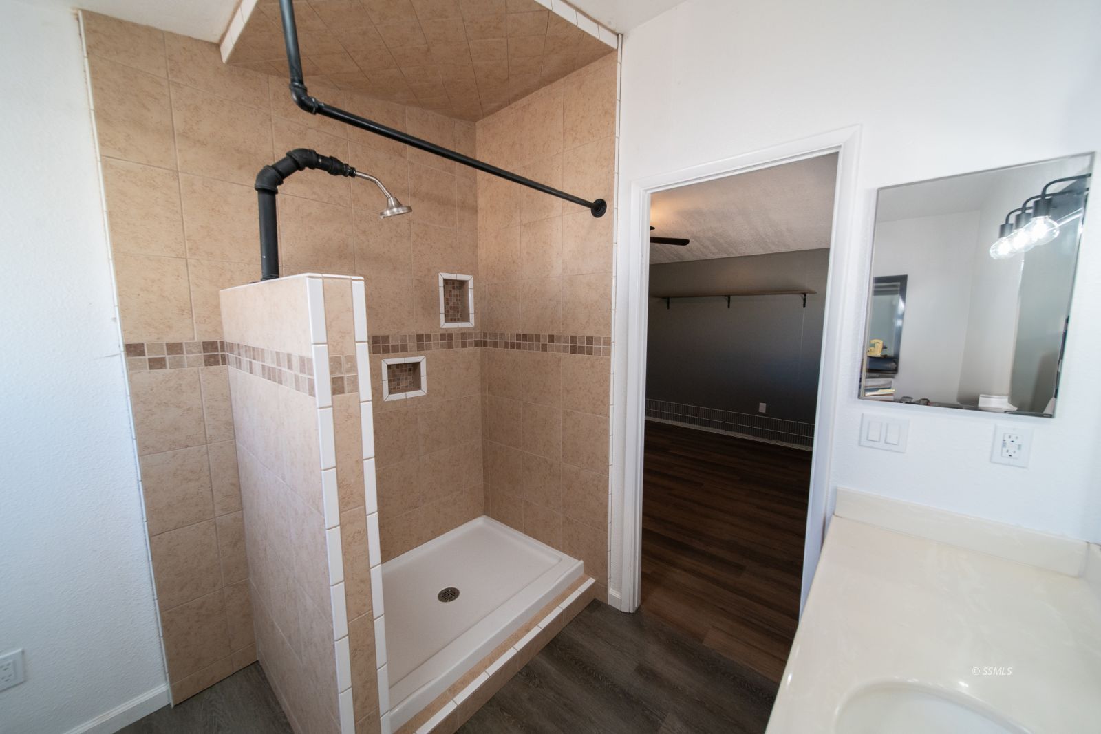 1219 South Garth Street Ridgecrest, CA 93555 - Photo 17 of 23 a bathroom with a shower and a mirror