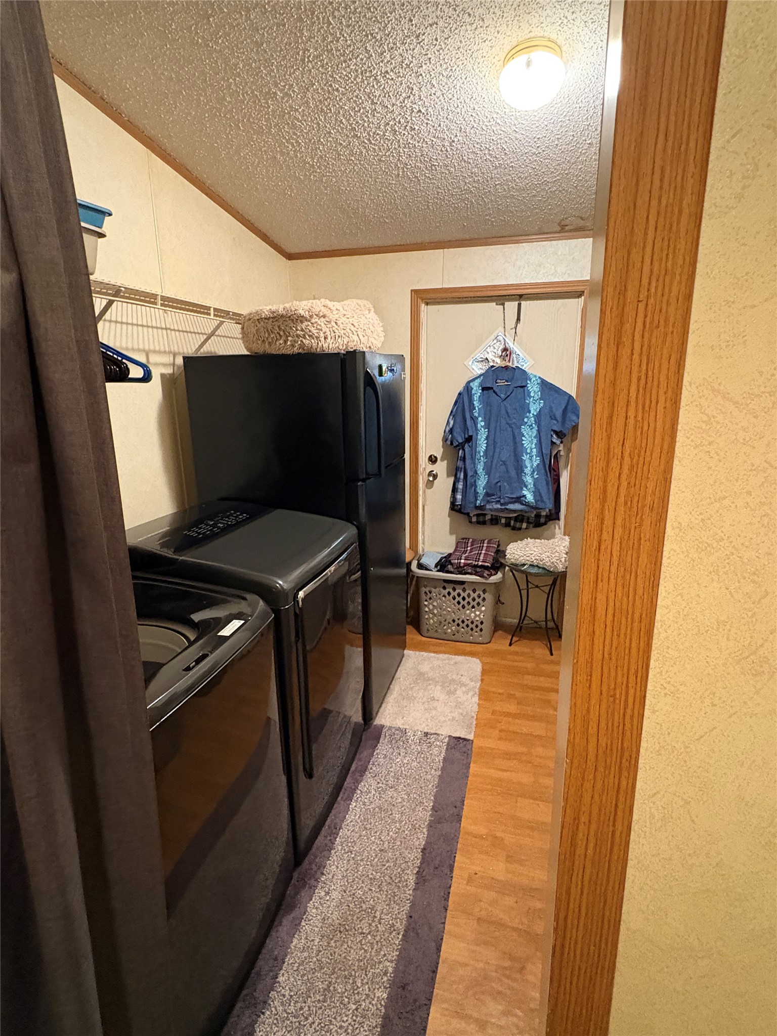 219 High View Ranch Drive Cedar Creek, TX 78612 - Photo 15 of 18 a hallway with washer and dryer