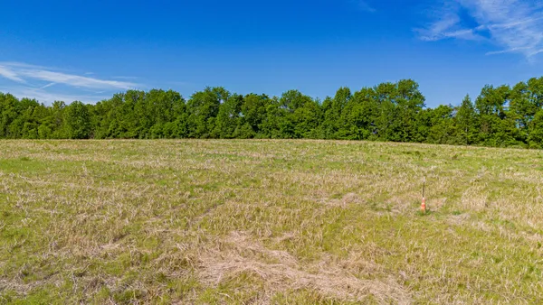 a view of a field with an outdoor space
