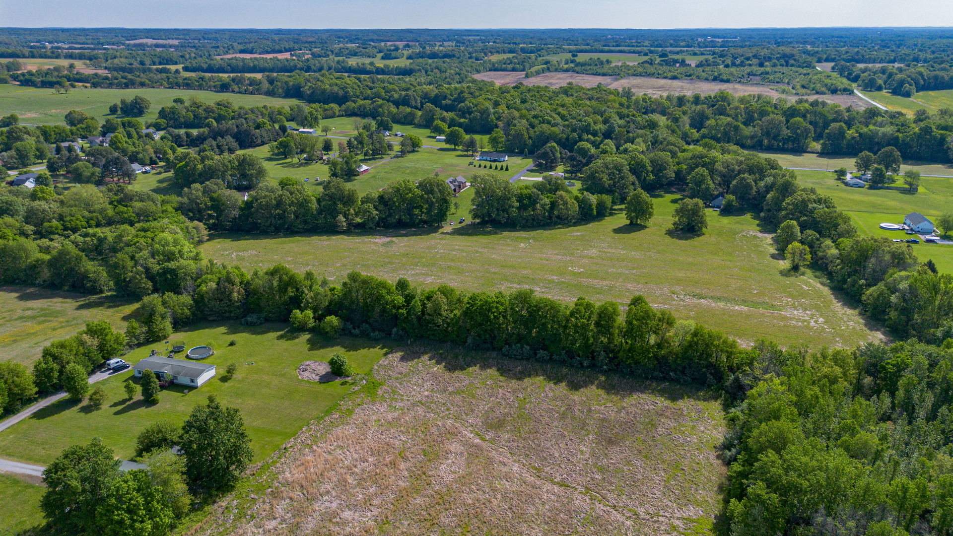 0 Adams Way Metropolis, IL 62960 - Photo 5 of 13 an aerial view of a house with a yard and lake view