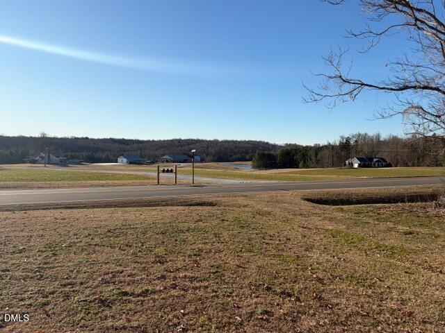 1151 Morton-Pulliam Road Roxboro, NC 27574 - Photo 17 of 27 View from front porch or the house-Look across to a pasture and a pond.