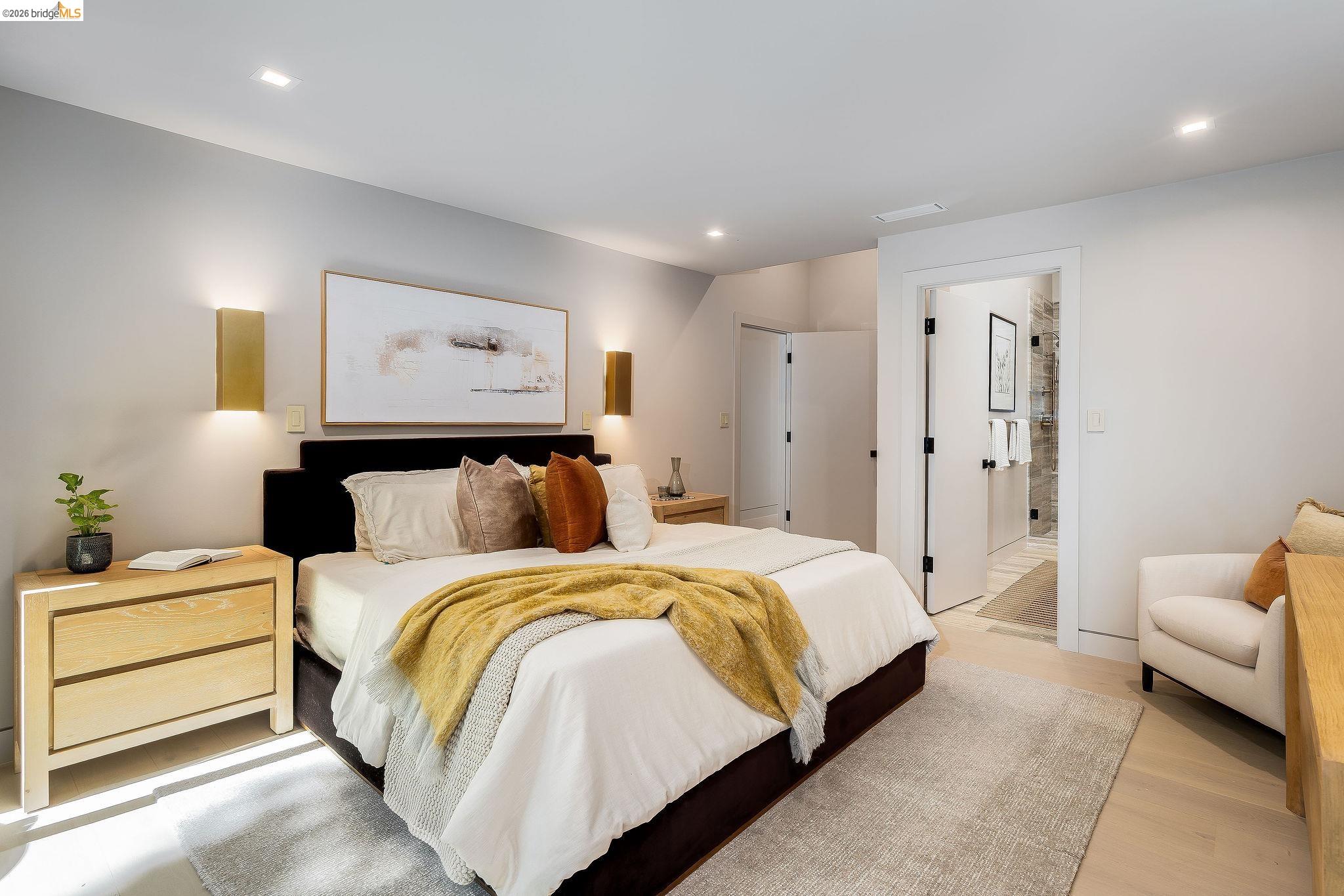5645 Bacon Road Oakland, CA 94619 - Photo 44 of 94 Bedroom featuring light-tone wood-finish flooring, recessed lighting, and wall-mounted sconces