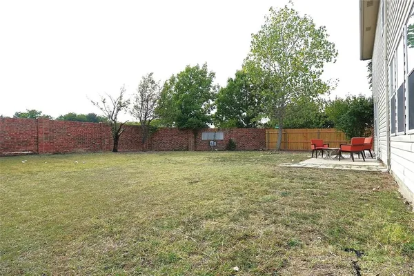 a view of a backyard with a garden