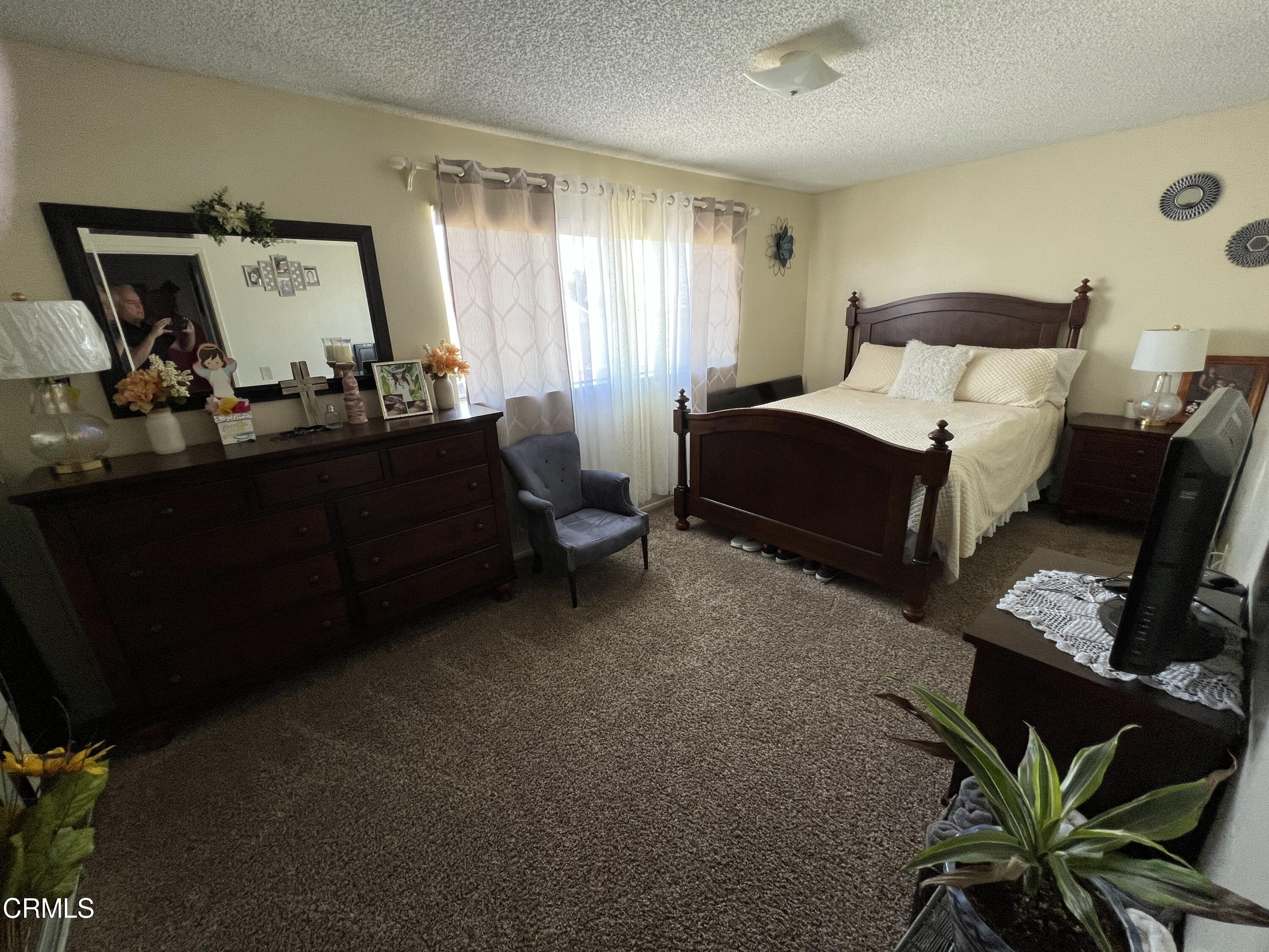 2060 Falkner Place Oxnard, CA 93033 - Photo 6 of 12 a bed room with furniture and a window