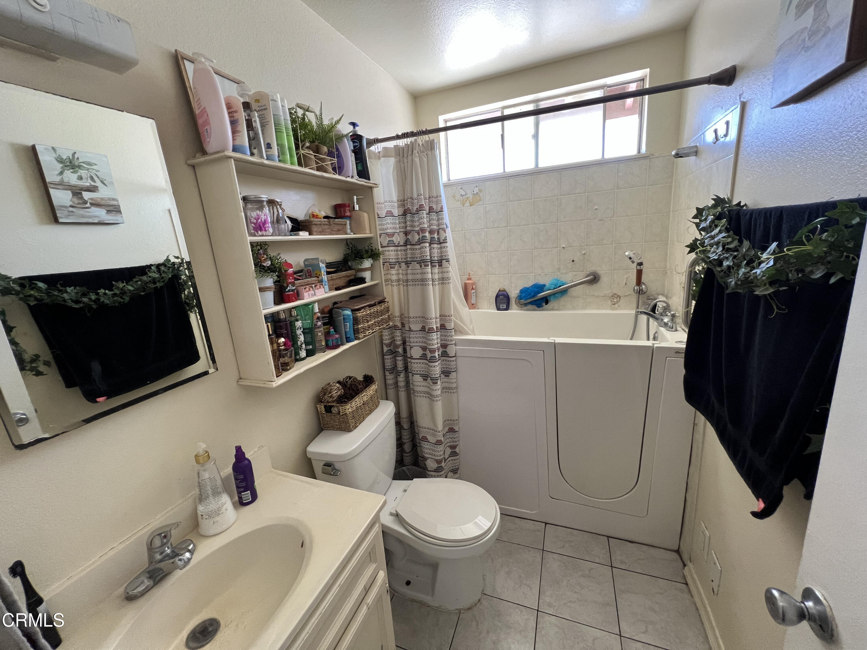 2060 Falkner Place Oxnard, CA 93033 - Photo 10 of 12 a bathroom with a sink toilet and shower