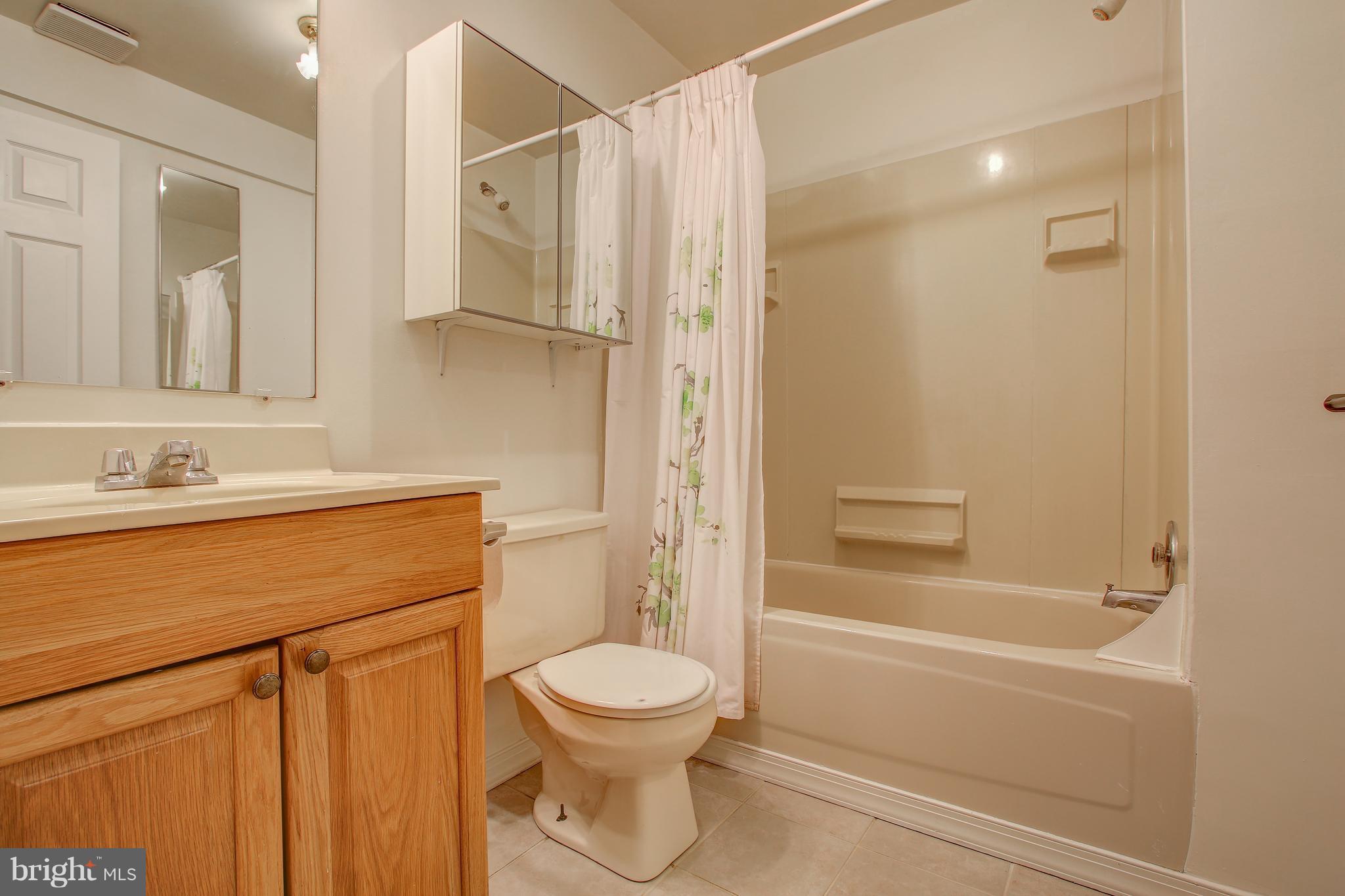700 Bryants Nursery Road Silver Spring, MD 20905 - Photo 36 of 41 a bathroom with a toilet sink and shower