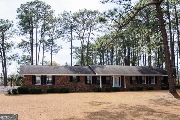 a bedroom with a bed and a mirror
