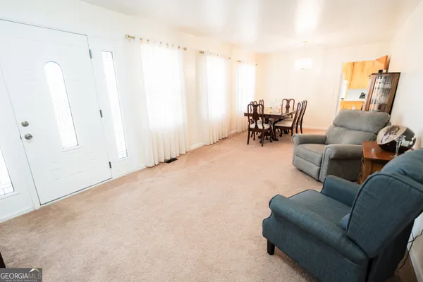 a view of entryway with wooden floor and door