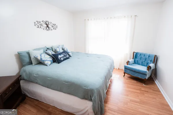 a view of a house with a yard covered in snow