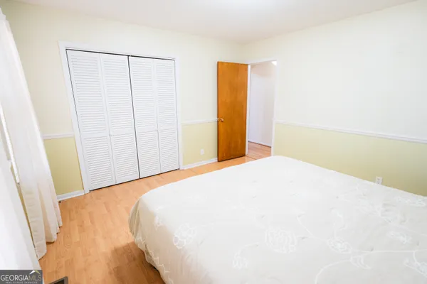 a bathroom with a granite countertop sink a mirror and a window