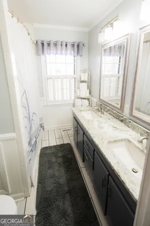 a bathroom with a sink and a toilet