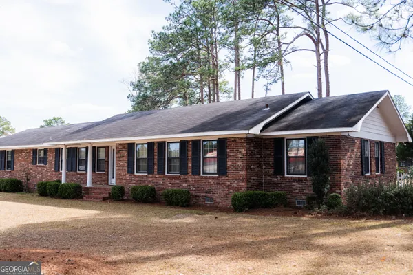 a front view of a house with a porch