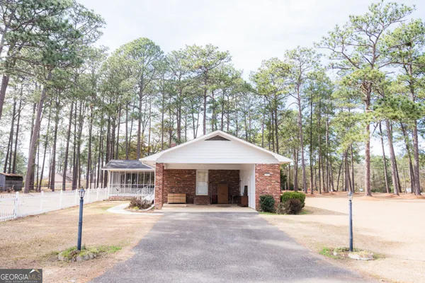 a front view of a house with brick walls
