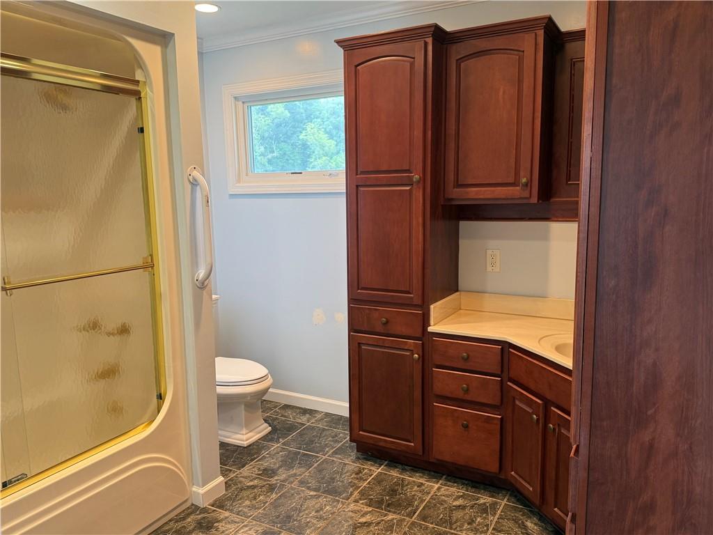 600 Moore Road Washington, PA 15301 - Photo 12 of 16 a bathroom with a granite countertop sink toilet and shower