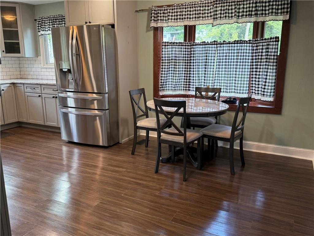 600 Moore Road Washington, PA 15301 - Photo 4 of 16 a backyard of a house with wooden floor table and chairs