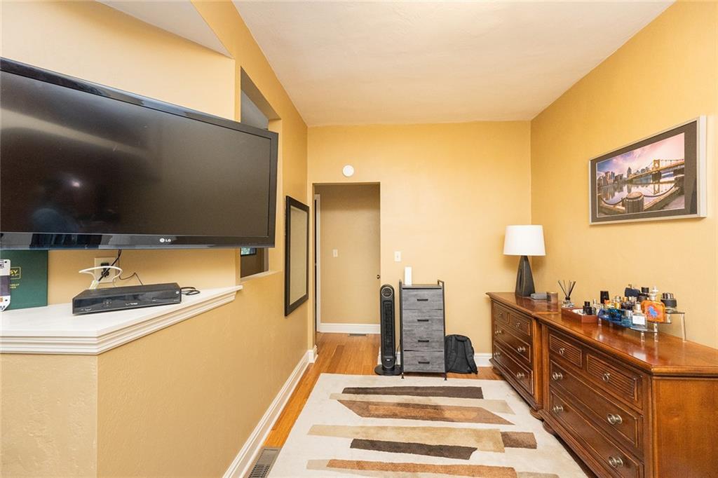 2220 Sarah Street, Unit 2 Pittsburgh, PA 15203 - Photo 16 of 34 a spacious bathroom with a double vanity sink and a mirror