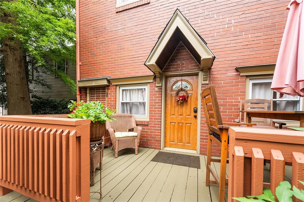 2220 Sarah Street, Unit 2 Pittsburgh, PA 15203 - Photo 17 of 34 a view of a house with entrance stairs and a garden
