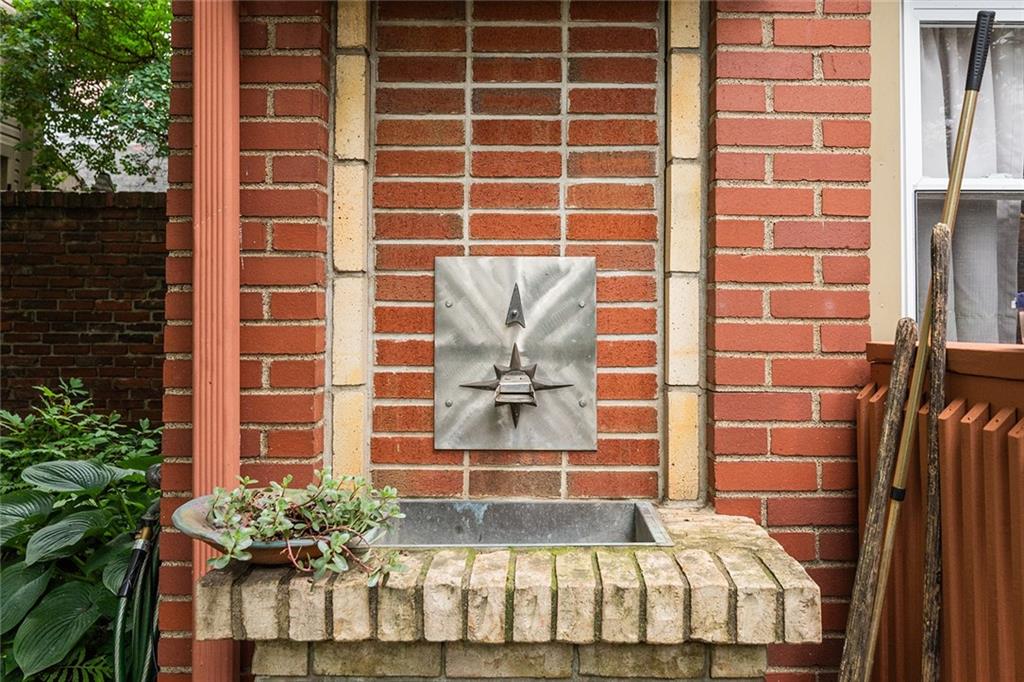 2220 Sarah Street, Unit 2 Pittsburgh, PA 15203 - Photo 24 of 34 a front view of a house with a garden