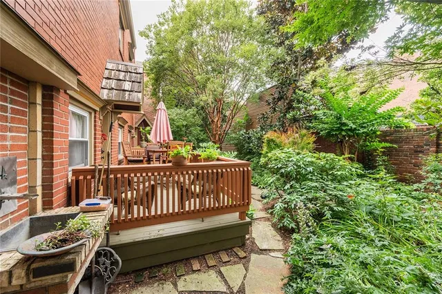 a view of a chair and table in the balcony
