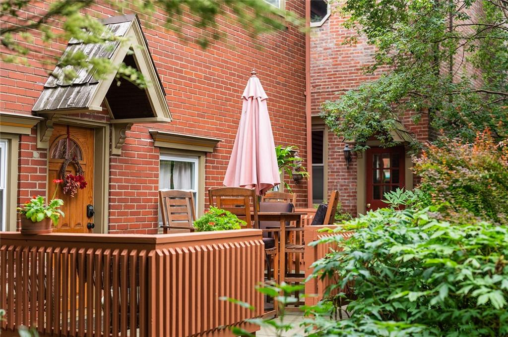 2220 Sarah Street, Unit 2 Pittsburgh, PA 15203 - Photo 29 of 34 a front view of a house with a garden
