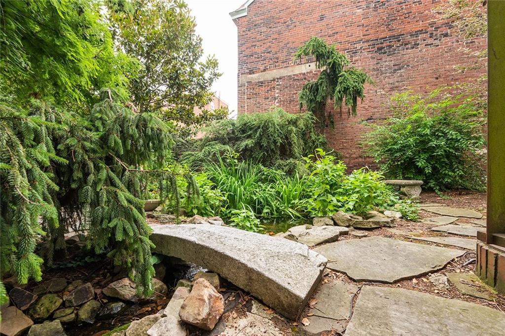 2220 Sarah Street, Unit 2 Pittsburgh, PA 15203 - Photo 31 of 34 a view of backyard with plants and outdoor seating