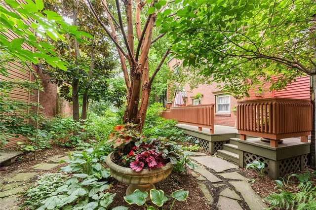 a view of a backyard with sitting area