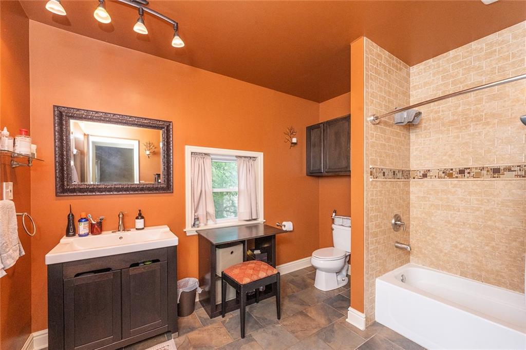 2220 Sarah Street, Unit 2 Pittsburgh, PA 15203 - Photo 10 of 34 a bathroom with a granite countertop sink toilet and shower