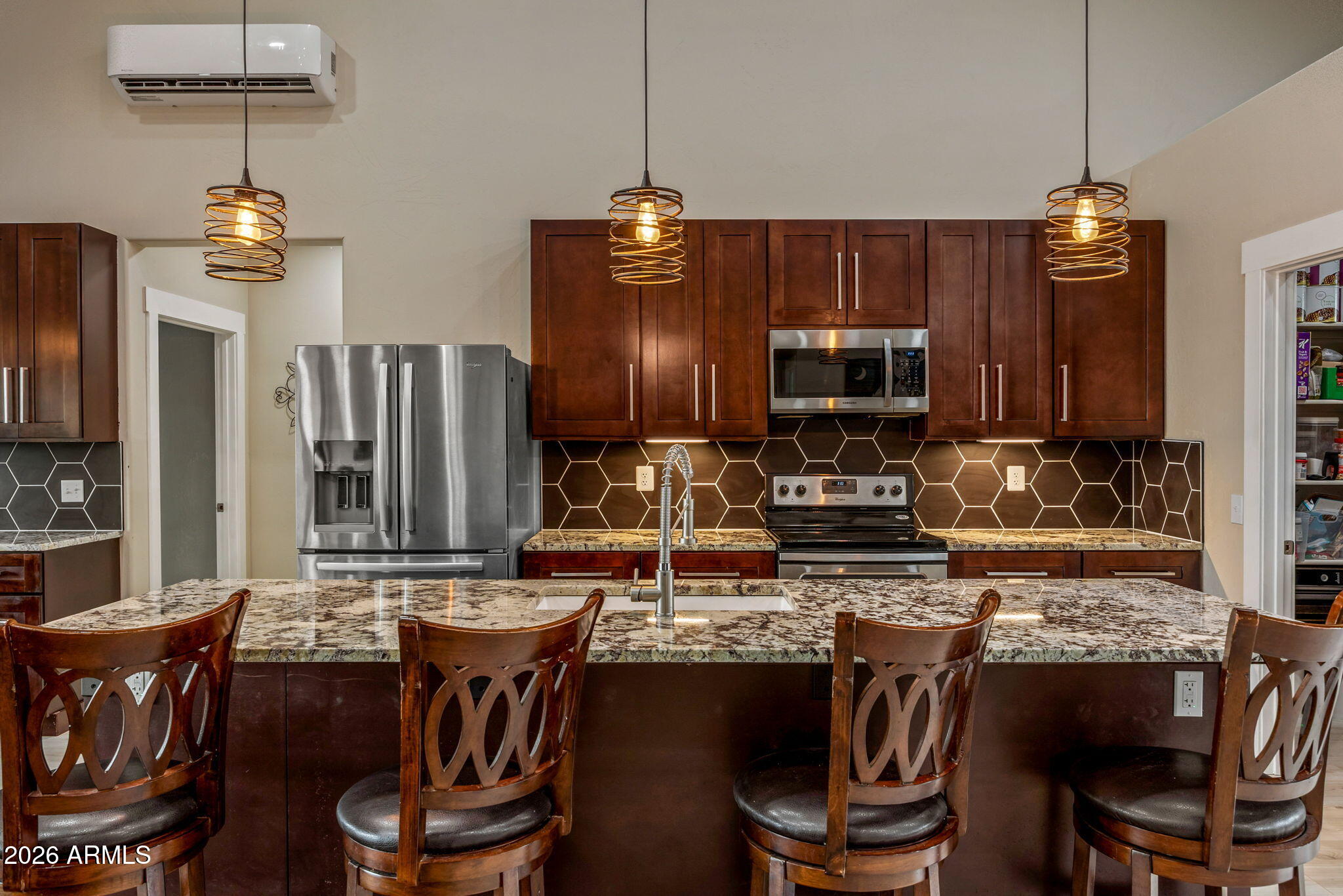 2270 Spitfire Circle Overgaard, AZ 85933 - Photo 12 of 47 a kitchen with a dining table and chairs