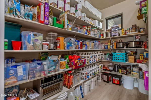 a room with lots of books and a baby crib
