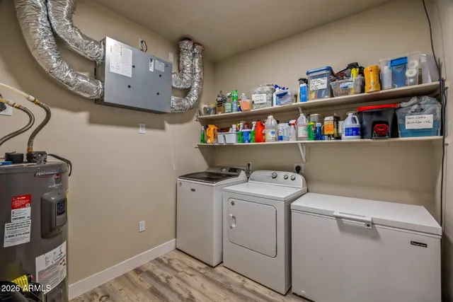 a view of storage and utility room with washer and dryer